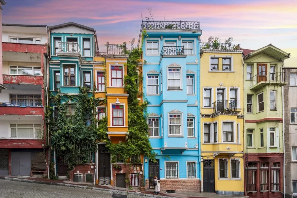 Row of brightly painted historic houses on a hillside street in Balat, Istanbul