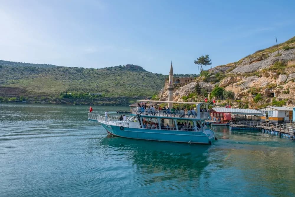 A tour boat on the Euphrates at Halfeti, with the half-submerged minaret in view